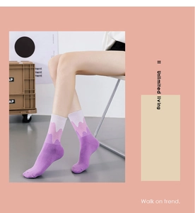 Detailed knit texture of trendy purple gradient crew socks shown on model feet