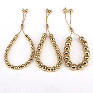 Three gold beaded bracelets with adjustable slide closures in 6mm, 8mm, and 10mm sizes