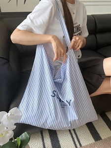 Blue and white striped canvas tote bag with lettering print for casual daily use