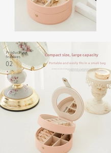 Pink semi-circle jewelry box detail showing mirror, earring plate, and ring slots storage