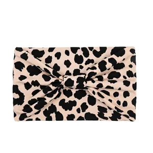Elastic wide leopard print headband for sports and makeup with a stylish front twist design