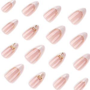 White marble almond press-on nails with gold foil lines and 3D metal butterfly bows
