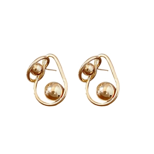 Golden twisted metal stud earrings with double spheres and minimalist abstract design