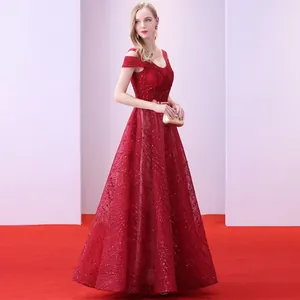 Elegant red off-shoulder evening gown with shimmering sequins and gold belt for women