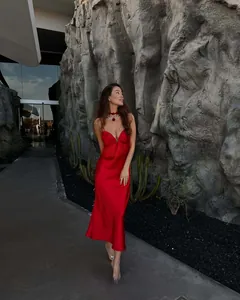 Elegant red satin midi dress featuring a deep V-neckline and smooth silk texture