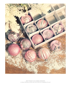 Detailed close-up of 6cm pink and silver Christmas balls with glitter and wave patterns