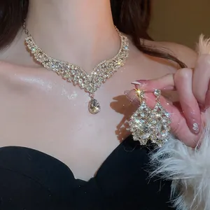 Elegant vintage jewelry set with sparkling water drop rhinestones and V-shaped necklace