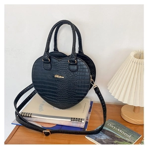 Détails du sac à main noir en forme de cœur à motif crocodile avec logo doré chic