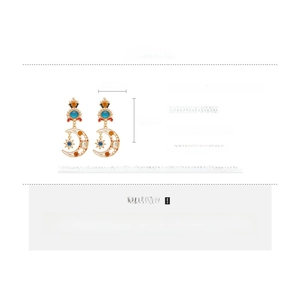 Detail view of crescent moon and star drop earrings with dimensions 6.8cm by 2.7cm