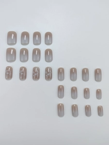 Detail of 24pcs square press-on nails with grey gradient and white floral line art