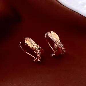 14K gold plated hoop earrings with twisted design and brilliant cubic zirconia pavé