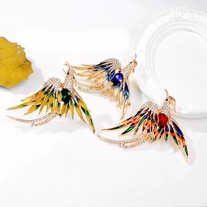 Luxurious enamel phoenix brooches with vibrant crystals and colorful gemstones on gold