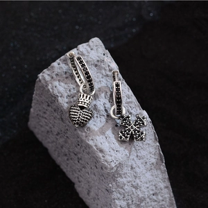 Hip hop black zircon heart cross asymmetric hoop earrings on grey textured stone