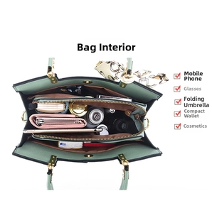 Top view of green litchi texture handbag showing large capacity and internal compartments