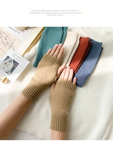 Detail of multi-color knitted fingerless gloves for women with cozy warm wool texture