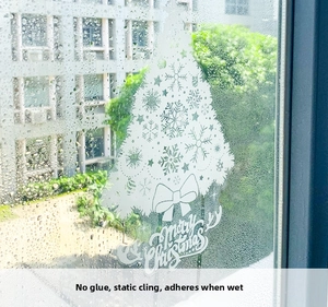 White Christmas tree window cling with Merry Christmas text and snowflake details