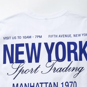 White cotton t-shirt featuring New York Sport Trading graphic and clean crew neck detail