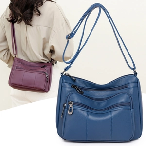 Classic soft leather crossbody bag with multi-pocket design and adjustable shoulder strap