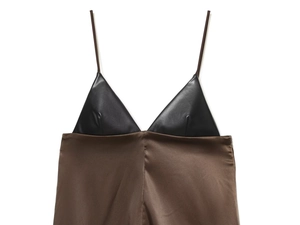 Detail of faux leather triangle cup and satin stitching on black and brown top