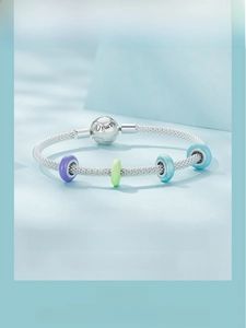 Detailed macro view of 925 sterling silver mesh bracelet with colorful silicone beads