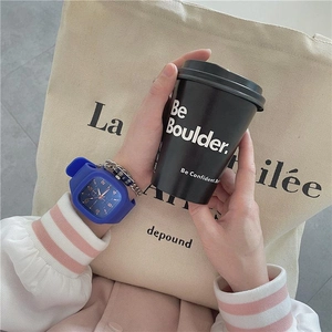 Blue square silicone watch for girls shown on model wrist holding a coffee cup