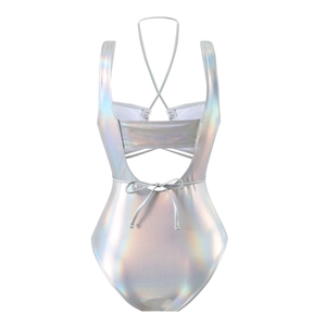 Detail of laser holographic silver swimsuit featuring cross back straps and cutout design
