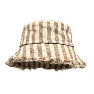 Detail of striped cotton linen bucket hat featuring unique frayed edges and textured fabric