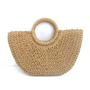 Minimalist straw tote bag with round handle in natural color for beach and vacation