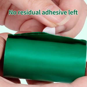 Close-up of biodegradable dog poop bag showing easy-peel sticker with no residue left.