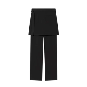 Detailed view of black layered skirt-trousers featuring minimalist belt and deconstructed cut
