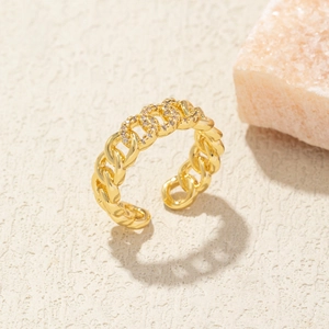 Detail of adjustable gold chain link ring featuring sparkling white crystal accents