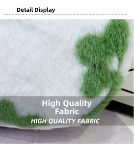Detail of high quality plush fabric with soft white and green faux fur texture