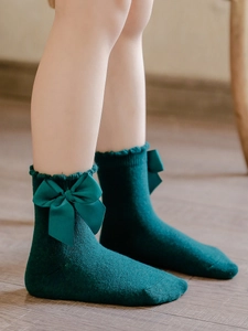Dark green princess cotton socks for girls with large satin bow and ruffled trim