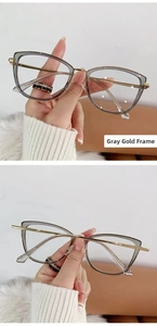 Detailed view of gray and gold cat-eye glasses frame with metallic temples and bridge
