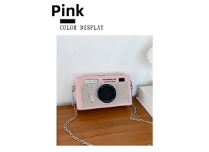 Detail of creative pink camera shape crossbody bag with rhinestones and chain strap