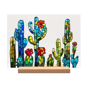 Detail of colorful acrylic cactus art piece with stained glass texture on wood base