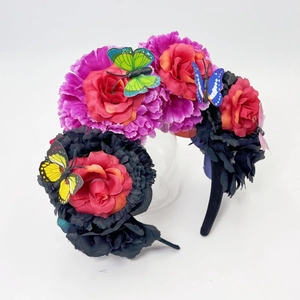 Close-up of Mexican Day of the Dead headband with colorful flowers and butterflies