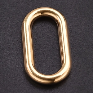 Macro shot of a golden oval stainless steel ring accessory for DIY jewelry crafts