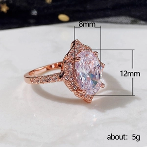 Rose gold halo engagement ring with 12x8mm oval zircon stone and brilliant pave details