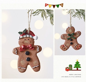 Macro detail of gingerbread man ornaments with sugar-like texture and twine hangers