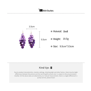 Detailed view of purple shell sequin tassel earrings with 9.5cm drop length measurements