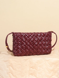 Burgundy woven leather shoulder bag with adjustable strap and golden hardware