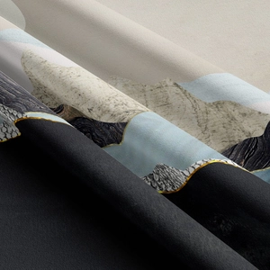 Close-up of abstract mountain landscape tapestry with golden outlines and soft fabric texture