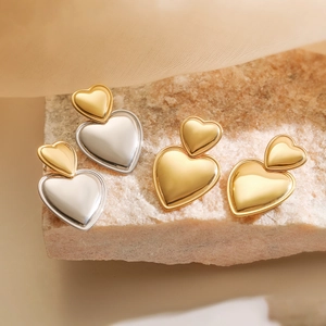 Minimalist heart-shaped stainless steel earrings in gold and two-tone finishes
