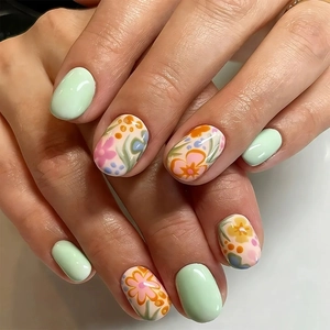 Short square mint green press-on nails with delicate floral patterns and glossy finish