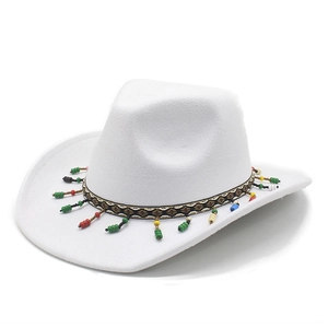Detail of white wool western cowboy hat with colorful beaded tassel decorative band
