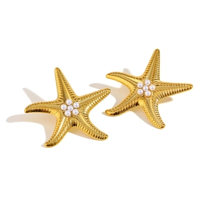 Golden starfish stud earrings with a central pearl inlay on a white background