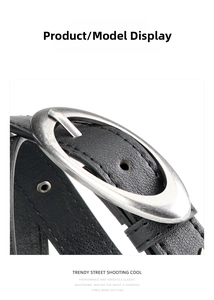 Detail of black lychee grain leather belt with vintage silver oval pin buckle