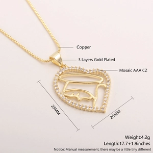 Detail of 18k gold plated heart pendant with AAA cubic zirconia and copper base material