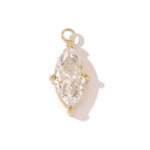 Macro shot of marquise-cut clear gemstone pendant in a gold-plated stainless steel setting